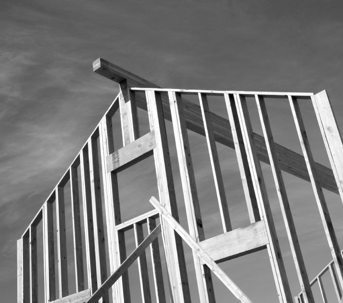 Close up of the top of a wooden building structure in black and white