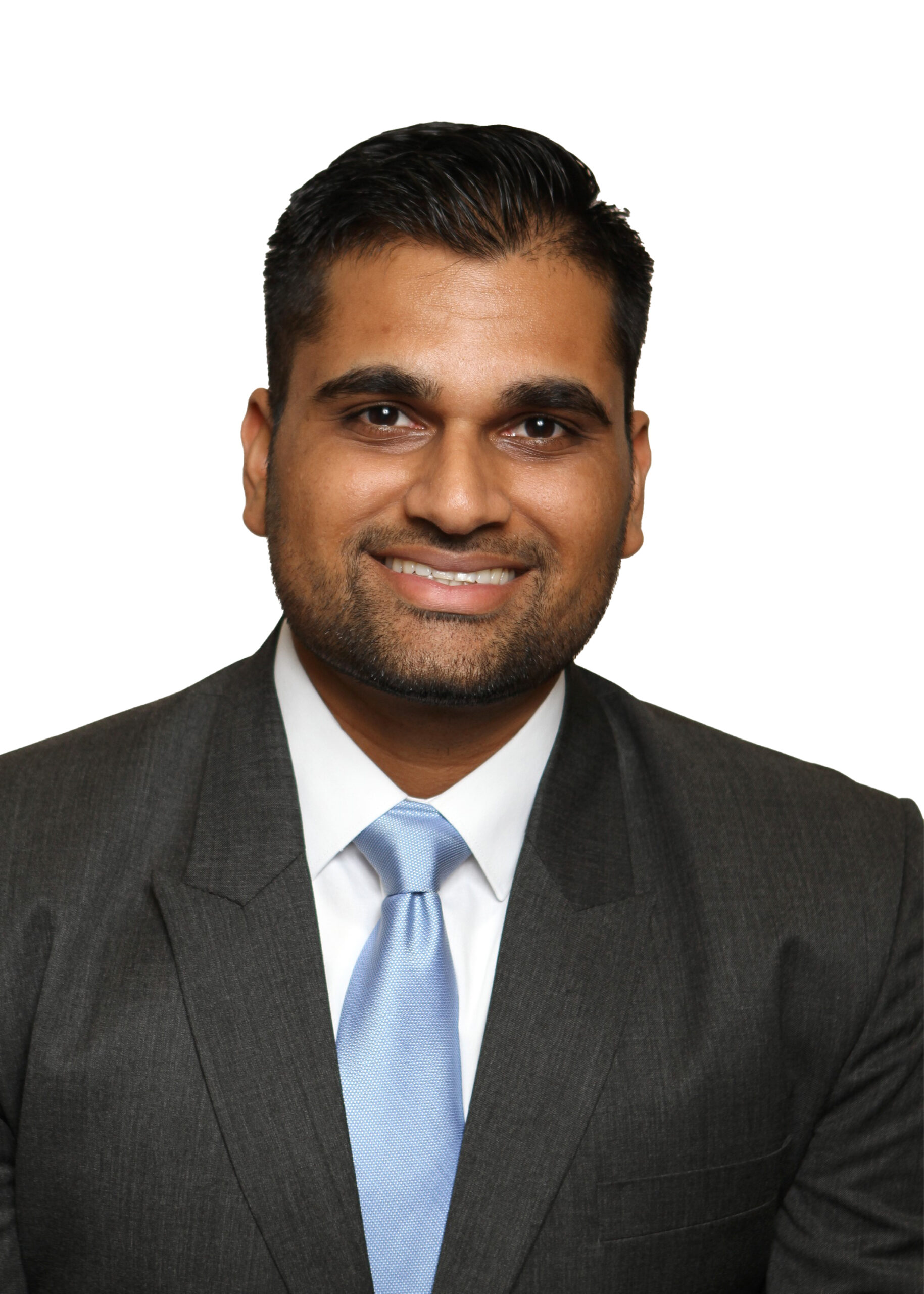 Brent Summers, a man in a suit and tie, smiling brightly.