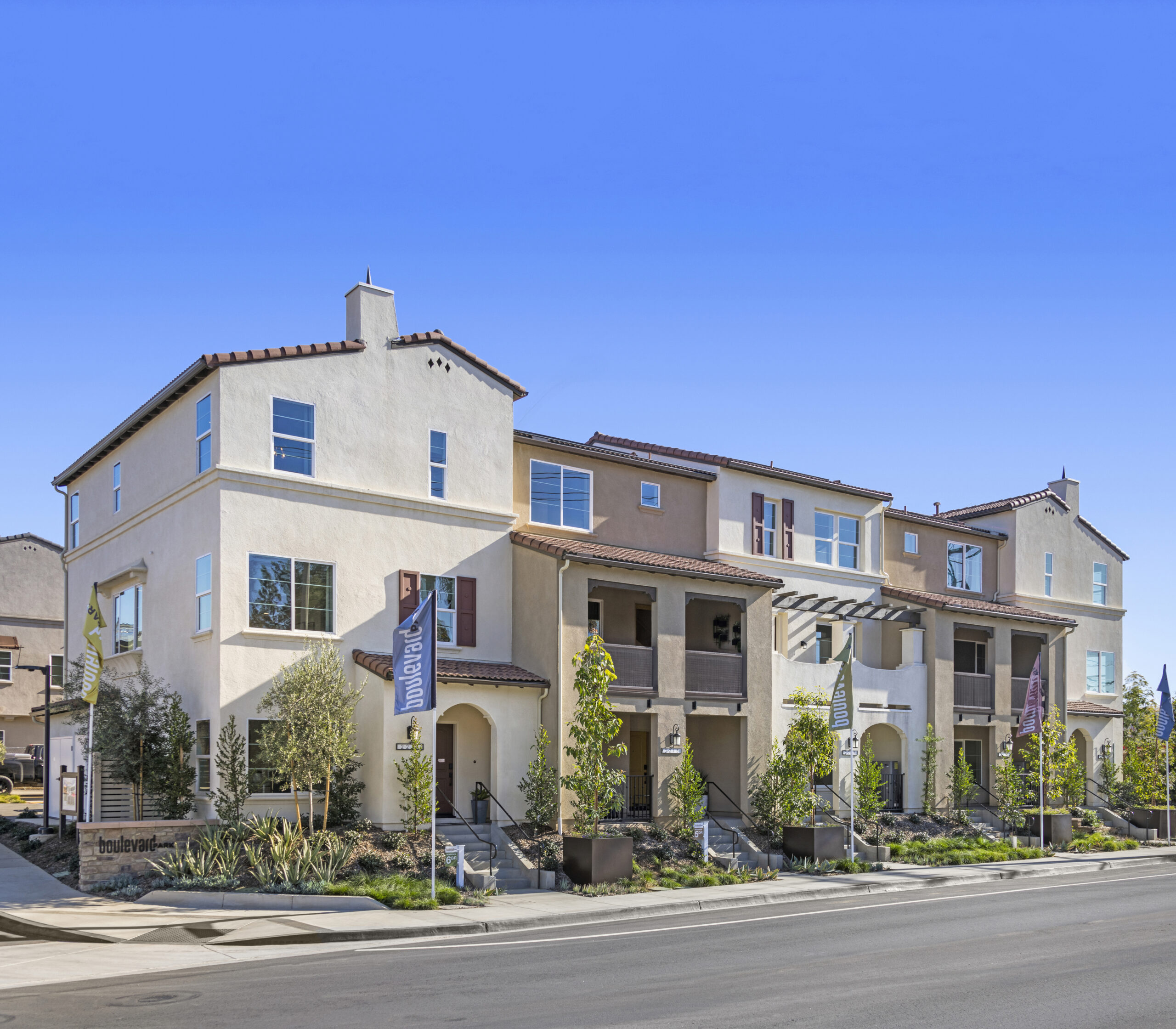 A row of townhouses on a real estate street.